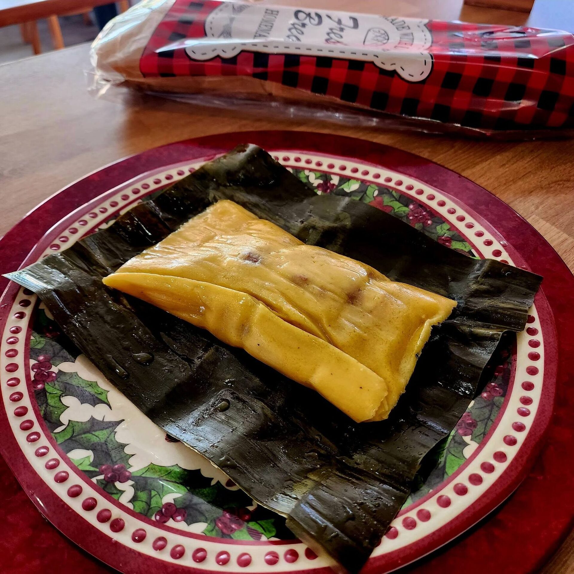 A Christmas hallaca unwrapped on its banana leaf