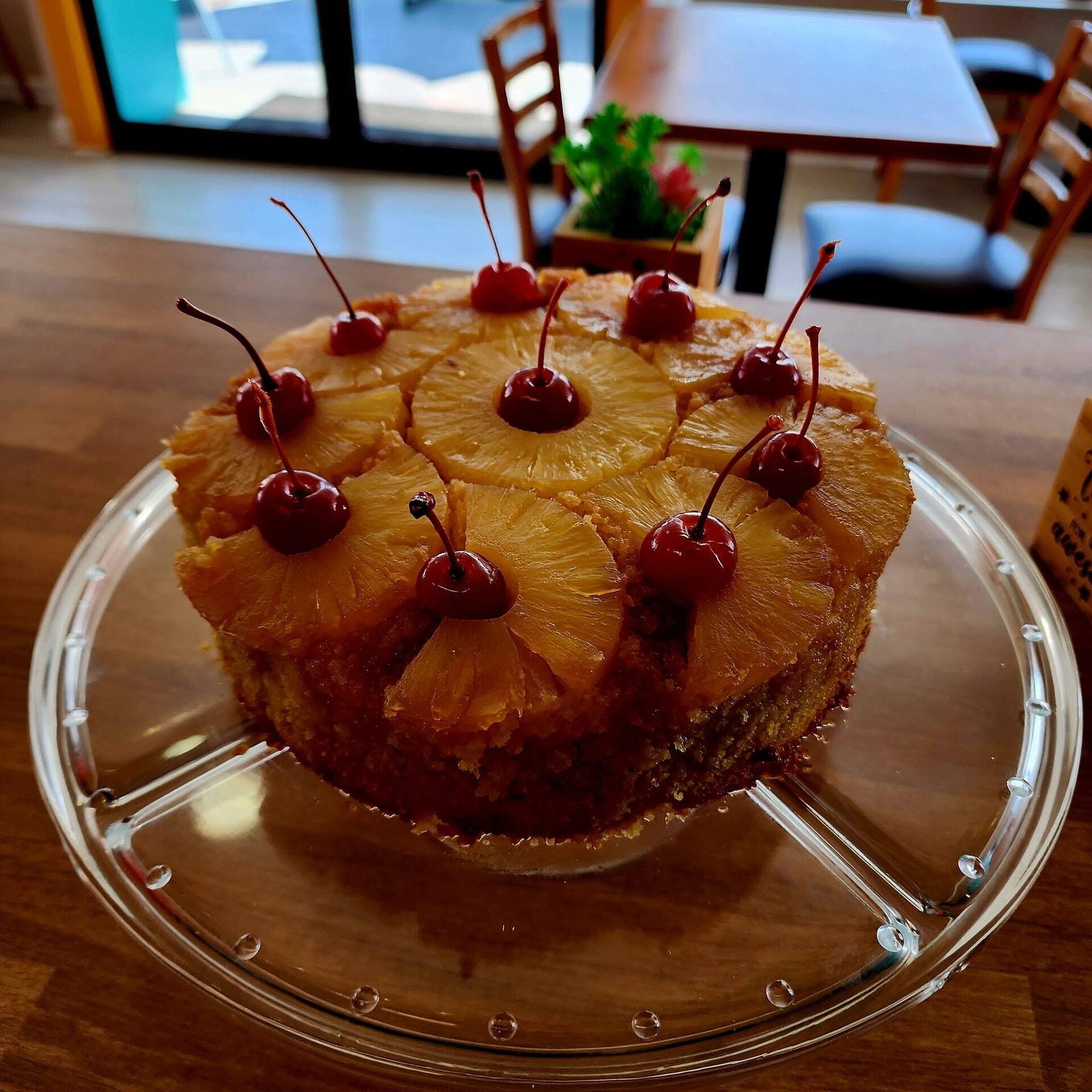 Pineapple upside-down cake topped with cherries