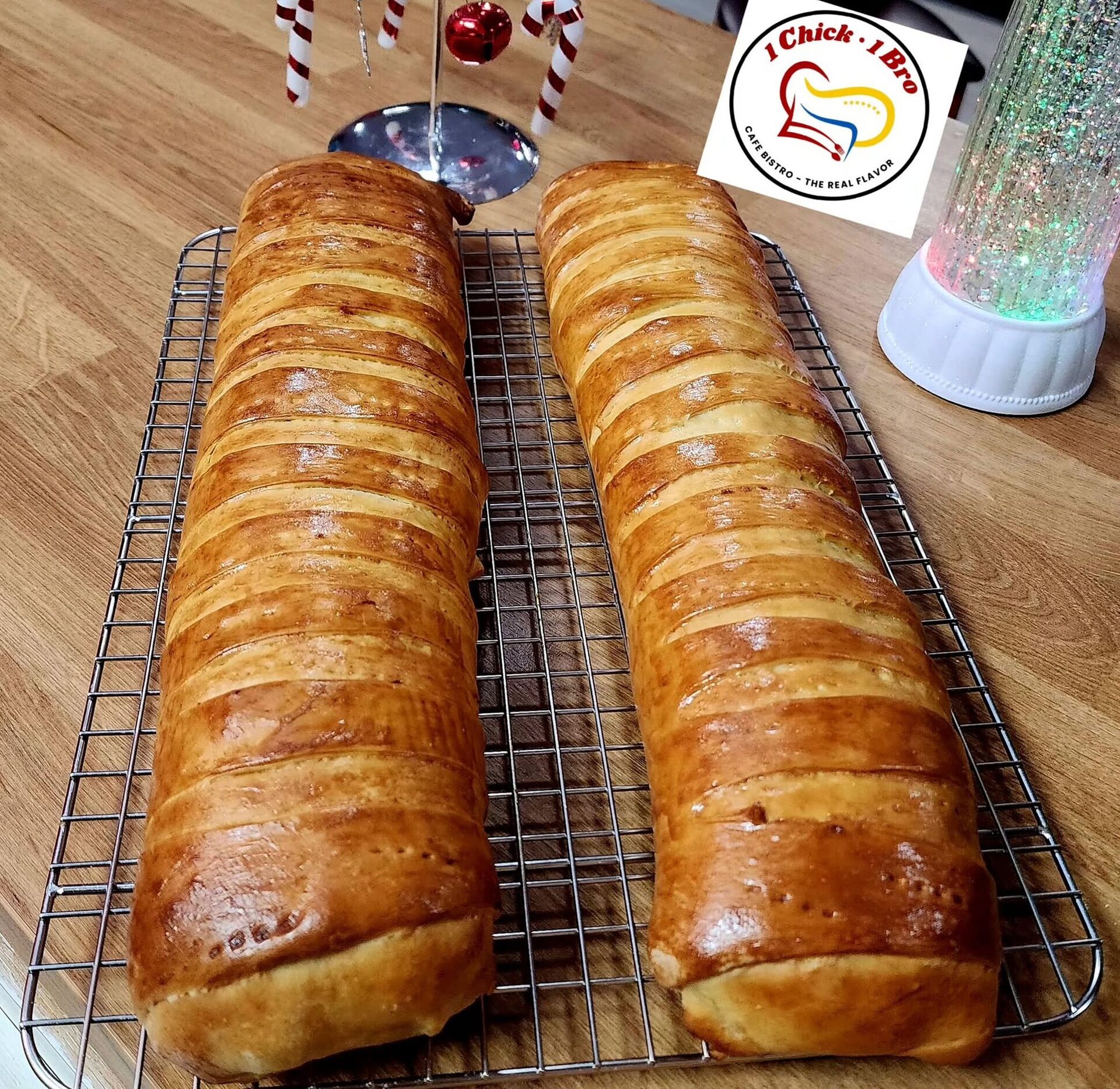 Two loaves of pan de jamón cooling on a wire rack
